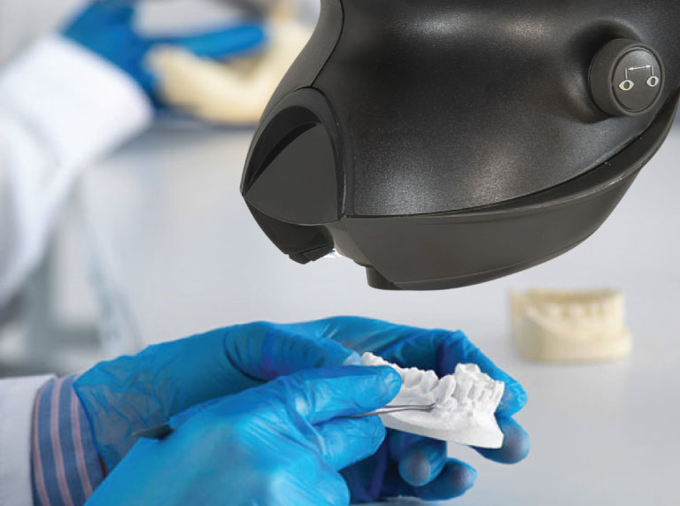 OPTA-body-image-dental-application-768x572px Close of dental application under OPTA stereo microscope